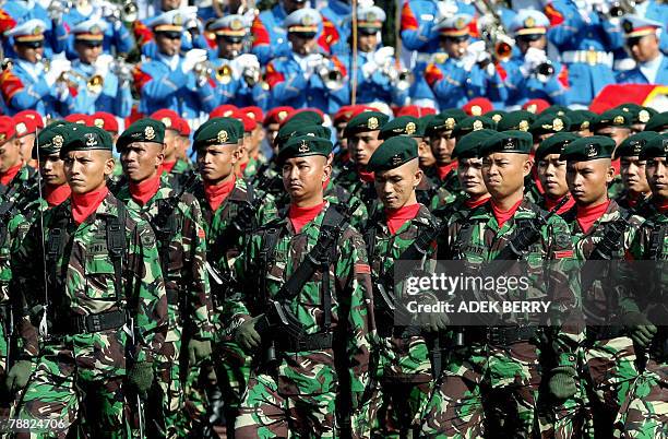 Soldiers march as outgoing Indonesian armed forces chief General Djoko Suyanto hands over his duty to incoming armed forces chief General Djoko...