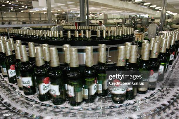 Bottle of freshly-brewed Pilsner-Urquell lager beer run through the newly-built, ultra-modern bottling plant at the Prazdroj brewery November 15,...