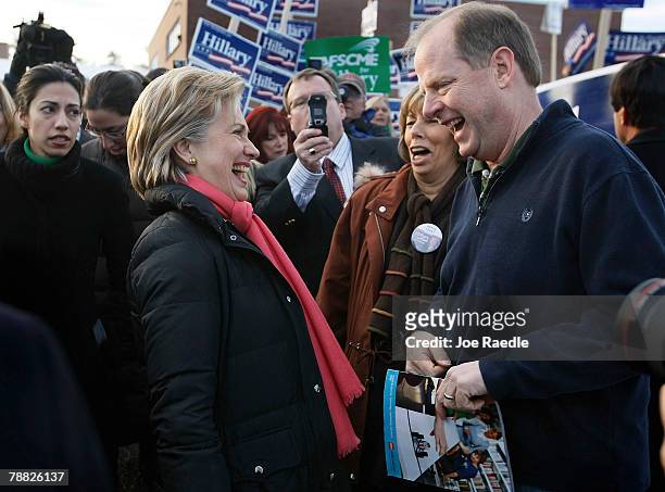 Democratic presidential candidate Sen. Hillary Clinton shares a joke with voters at the Fairgrounds Middle School polling location on election day...