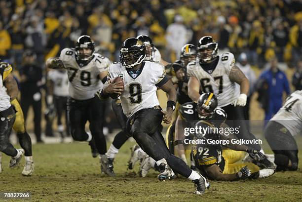 Quarterback David Garrard of the Jacksonville Jaguars scrambles for 32-yards and a first down during the fourth quarter of an AFC Wild Card game...