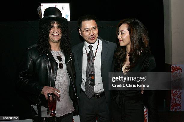 Slash of Guns N'Roses, Velvet Revolver and Spectroniq CEO Leo Chen and wife Emily at the Spectroniq 3-D CES Party at The Joint at the Hard Rock Hotel...