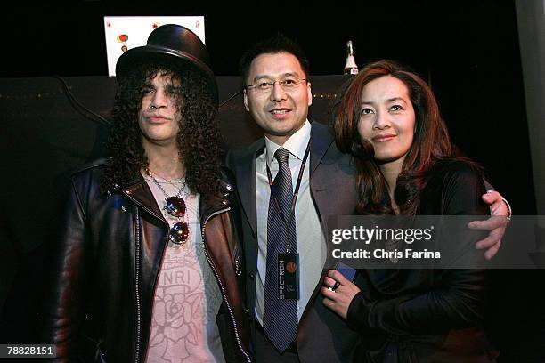 Slash of Guns N'Roses, Velvet Revolver and Spectroniq CEO Leo Chen and wife Emily at the Spectroniq 3-D CES Party at The Joint at the Hard Rock Hotel...