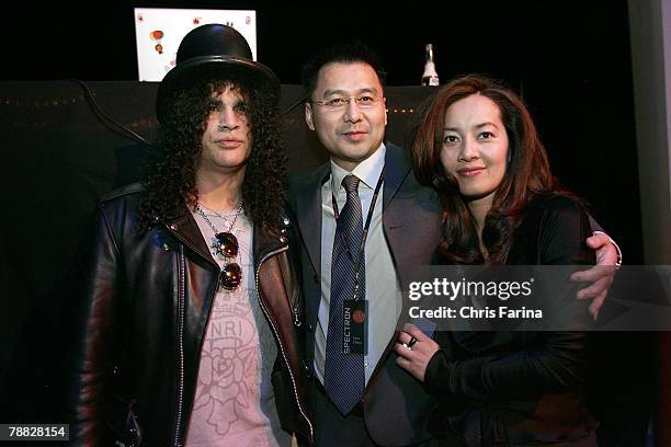 Slash of Guns N'Roses, Velvet Revolver and Spectroniq CEO Leo Chen and wife Emily at the Spectroniq 3-D CES Party at The Joint at the Hard Rock Hotel...