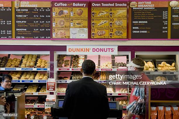 Democratic presidential candidate Illinois Senator Barack Obama makes an unplanned stop at a local Dunkin' Donuts 08 January 2008 in Manchester, New...