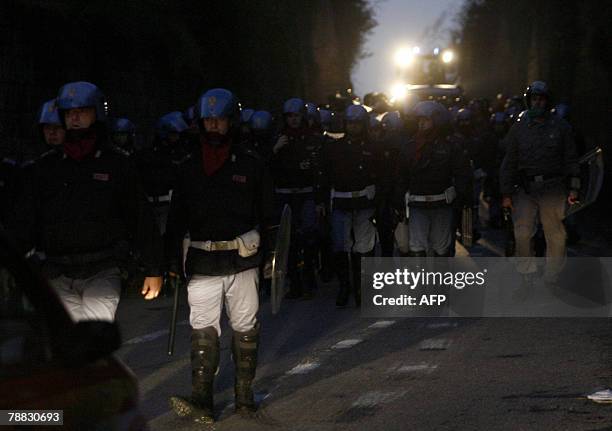 Policemen escort bulldozers to clean the streets in the Pozzuoli suburb west of Naples outside the Pianura dump, 08 January 2008. Italian troops will...