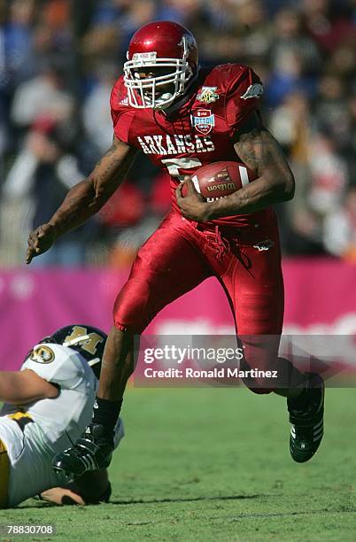 Darren McFadden of the Arkansas Razorbacks carries the ball against the Missouri Tigers during the AT&T Cotton Bowl Classic on January 1, 2008 at the...
