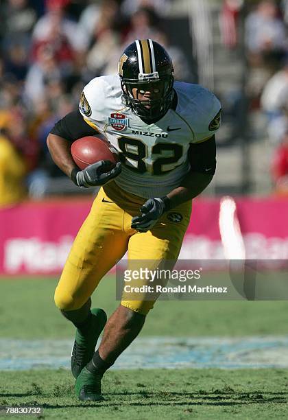 Martin Rucker of the Missouri Tigers carries the ball against the Arkansas Razorbacks during the AT&T Cotton Bowl Classic on January 1, 2008 at the...