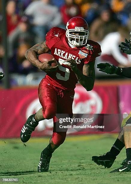 Darren McFadden of the Arkansas Razorbacks carries the ball against the Missouri Tigers during the AT&T Cotton Bowl Classic on January 1, 2008 at the...