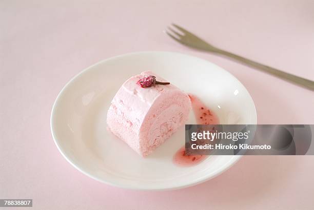 sponge roll - raspberry coulis stock pictures, royalty-free photos & images