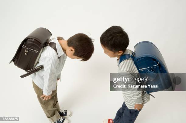 two elementary age boys bowing - 2 people bowing stock pictures, royalty-free photos & images