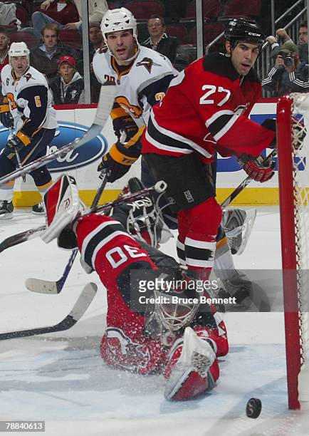 Shot by Paul Gaustad of the Buffalo Sabres hits the post as Martin Brodeur of the New Jersey Devils reaches for the puck on January 8, 2008 at the...