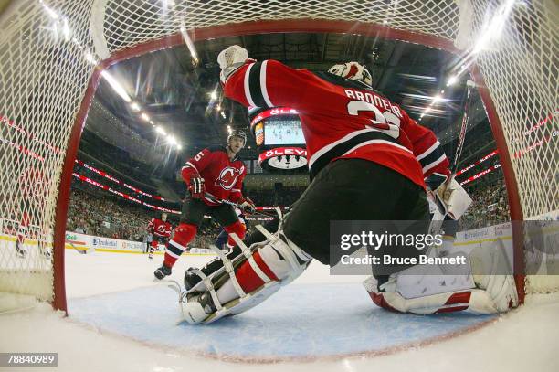 Goaltender Martin Brodeur and defenseman Colin White of the New Jersey Devils guard the net against the Buffalo Sabres on January 8, 2008 at the...