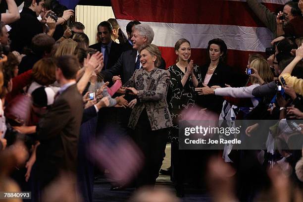 Democratic Presidential hopeful Sen. Hillary Clinton , former U.S. President Bill Clinton and daughter Chelsea Clinton react as they are introduced...