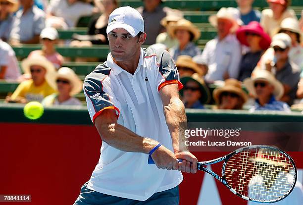 Andy Roddick of USA plays a backhand in his match against Ivan Ljubicic of Croatia during day one of the AAMI Classic at Kooyong Lawn Tennis Club on...