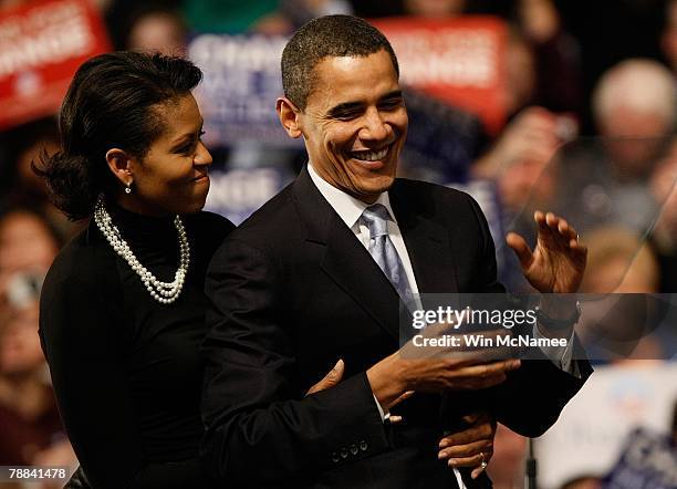 Democratic presidential hopeful Sen. Barack Obama is hugged by his wife Michelle Obama before his speech at a primary night rally in the gymnasium at...