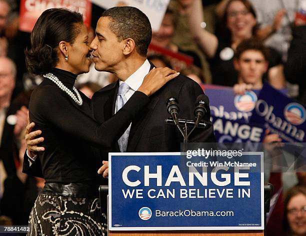 Democratic presidential hopeful Sen. Barack Obama is hugged by his wife Michelle Obama before his speech at a primary night rally in the gymnasium at...
