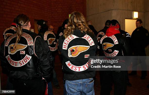 Policemen surround a member of the biker group 'Hells Angels' outside the district court on January 9, 2008 in Muenster, Germany. The two biker...