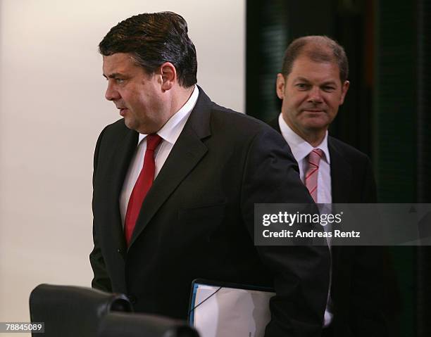 German Environment Minister Sigmar Gabriel and German minister of Work and Social Issues Olaf Scholz arrive for the weekly German cabinet meeting on...