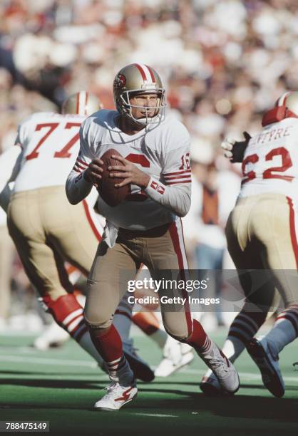 Joe Montana, Quarterback for the San Francisco 49ers prepares to throw a pass during the National Football Conference East game against the New York...