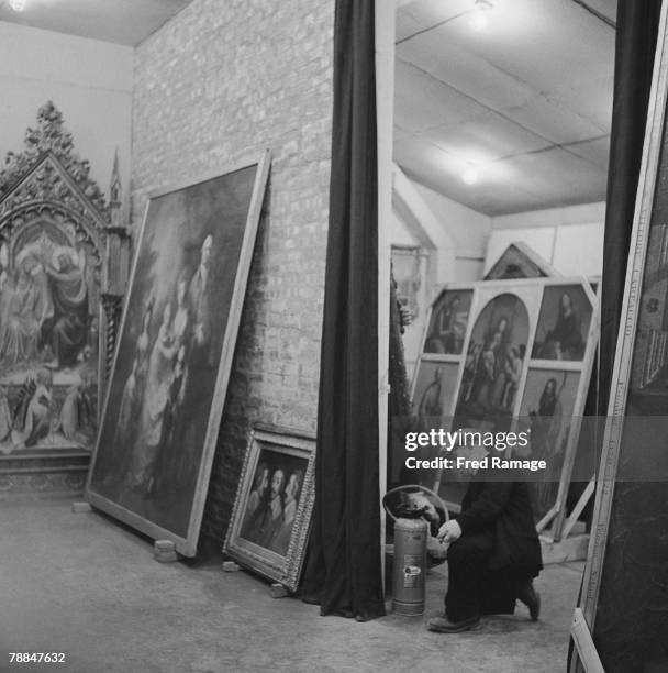 Art treasures from the National Gallery are moved to Manod Quarry slate caverns in Merionethshire, Wales, for safekeeping during World War II,...