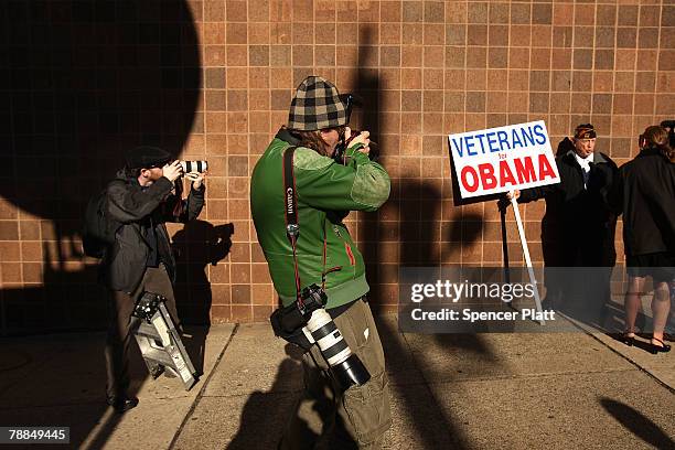 Photographers shoot a supporter of Democratic presidential hopeful Sen. Barack Obama January 9, 2008 in Jersey City, New Jersey. After a surprising...