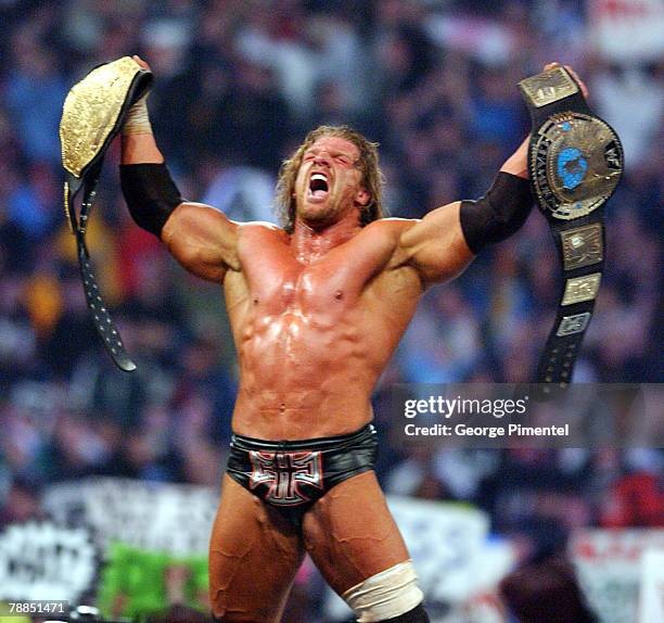 Triple H celebrates his victory at Wrestlemania X8