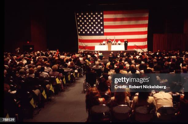 An immigration official speaks at the naturalization ceremony September 25, 1999 in Miami, FL. Three thousand people attended the swearing in...