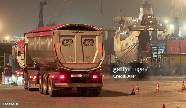 Some trucks board a ship in Naples heading to an unknown rubbish dump in Sardinia 09 January 2008. Since the waste disposal crisis developed late...