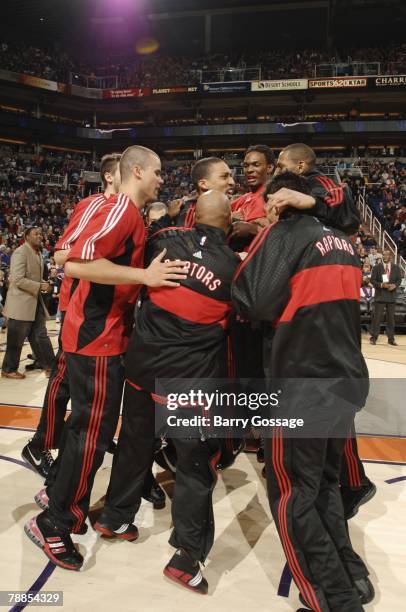 The Toronto Raptors celebrate in a team huddle as they prepare to take on the Phoenix Suns at U.S. Airways Center on December 22, 2007 in Phoenix,...