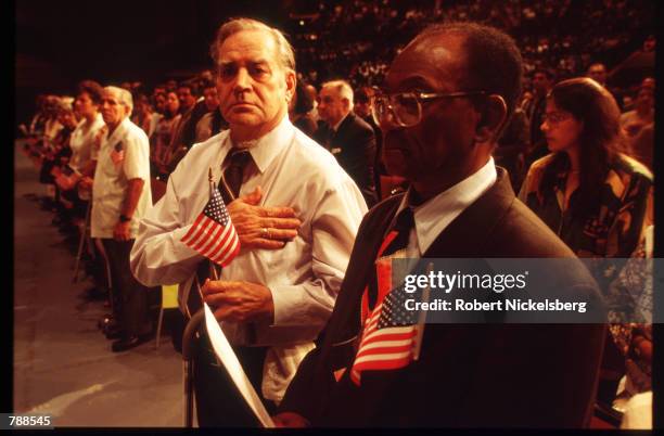 Mexican man stands during the citizenship ceremony September 25, 1999 in Miami, FL. Three thousand people attended the swearing in ceremony and took...