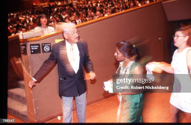 People enter the hall for the citizenship ceremony September 25, 1999 in Miami, FL. Three thousand people attended the swearing in ceremony and took...