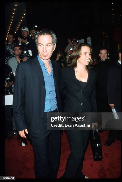 John McEnroe poses with Patty Smyth October 10, 1999 at the Ziegfeld Theatre in New York City. They attend the premiere of the film "The Story Of Us."