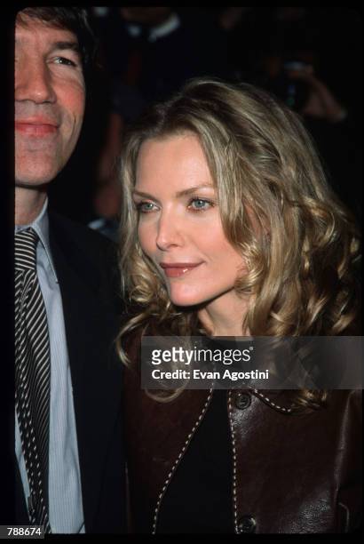 David E. Kelley and Michelle Pfeiffer pose October 10, 1999 at the Ziegfeld Theatre in New York City. They attend the premiere of the film "The Story...