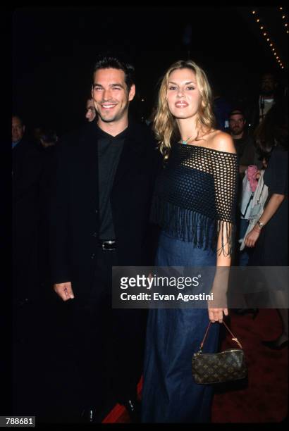 Eddie Librian poses with his wife October 10, 1999 at the Ziegfeld Theatre in New York City. They attend the premiere of the film "The Story Of Us."