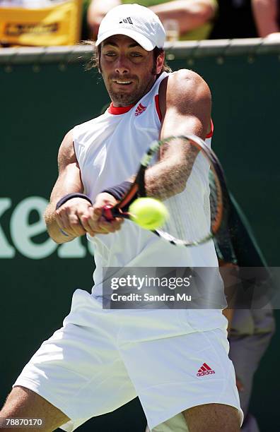 Nicolas Massu of Chile plays a backhand in his match against Juan Carlos Ferrero of Spain during day four of the Heineken Open at the ASB Bank Tennis...