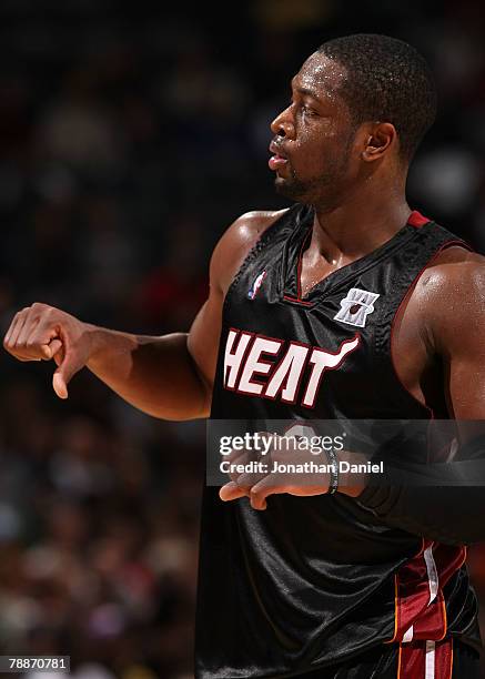 Dwyane Wade of the Miami Heat signals to coach Pat Riley during a game against the Milwaukee Bucks on January 9, 2008 at the Bradley Center in...