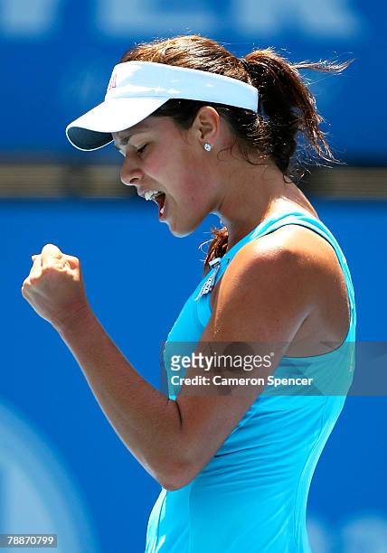 Ana Ivanovic of Serbia celebrates a point during her women's singles match against Justine Henin of Belgium during day five of the Medibank...