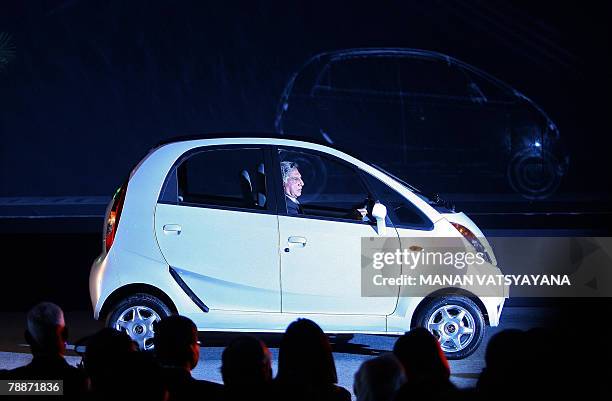 Chairman of the Tata Group, Ratan Tata drives the new Tata "Nano" car at the launch in New Delhi, 10 January 2008. India's giant Tata Group unveiled...