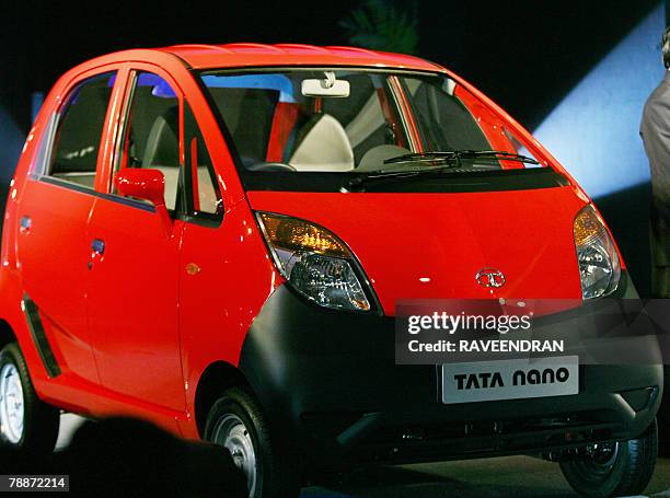 The new Tata "Nano" car is pictured during the launch in New Delhi, 10 January 2008. India's giant Tata Group unveiled a USD 2,500 car it bills as...