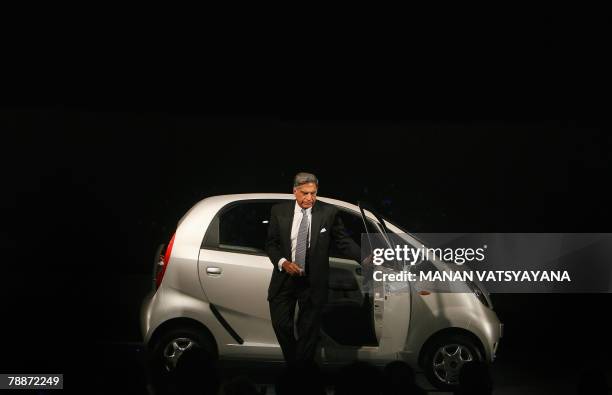 Chairman of the Tata Group, Ratan Tata comes out of the new Tata "Nano" car in New Delhi, 10 January 2008. India's giant Tata Group unveiled a USD...
