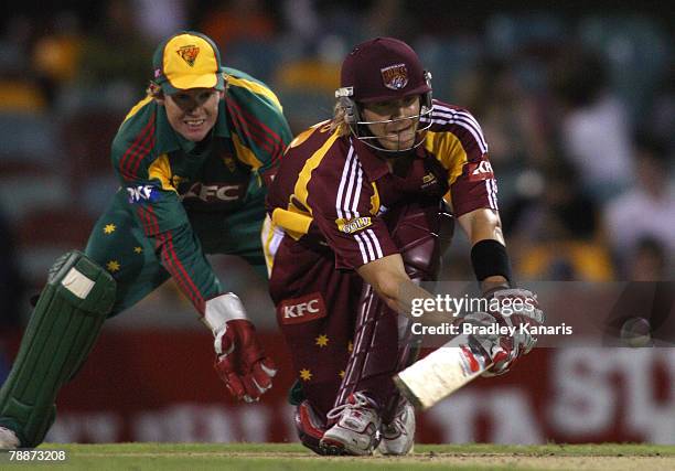 Shane Watson of the Bulls sweeps during the KFC Twenty20 Big Bash match between the Queensland Bulls and the Tasmanian Tigers at the Gabba on January...