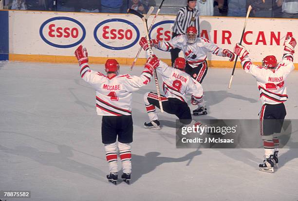 Team Canada celebrates during a game at the 1995 World Junior Championships, where Team Canada won the gold medal, Alberta, Canada, December 1995....