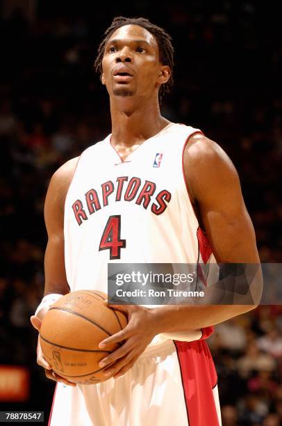 Chris Bosh of the Toronto Raptors prepares to shoot a free throw during the game against the Boston Celtics on December 16, 2007 at Air Canada Centre...