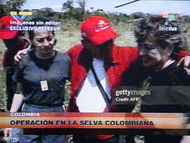 Grab released by the Venezelan presidency, of Colombian politicians Clara Rojas and Consuelo Gonzalez being hugged by former Venezuelan Interior and...