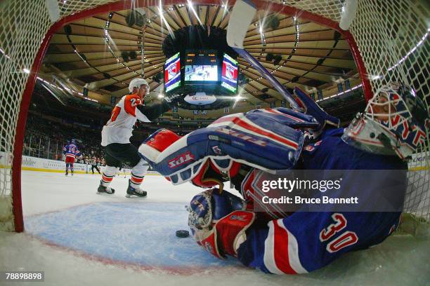 Steve Downie of the Philadelphia Flyers celebrates a goal by teammate Scott Hartnell at 10:42 of the second period against Henrik Lundqvist of the...