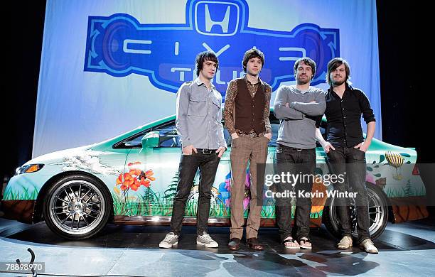 Members of the band Panic! at the Disco frontman Brendon Urie, guitarist Ryan Ross, bassist Jon Walker and drummer Spencer Smith pose onstage during...