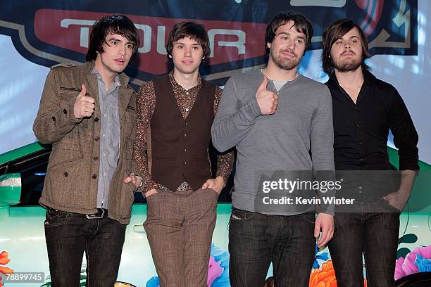 Members of the band Panic! at the Disco frontman Brendon Urie, guitarist Ryan Ross, bassist Jon Walker and drummer Spencer Smith pose onstage during...