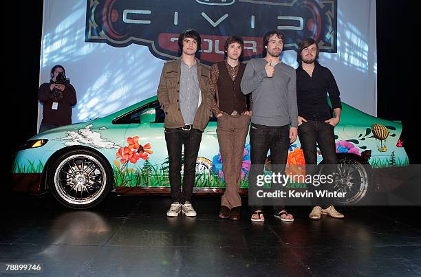 Members of the band Panic! at the Disco frontman Brendon Urie, guitarist Ryan Ross, bassist Jon Walker and drummer Spencer Smith pose onstage during...