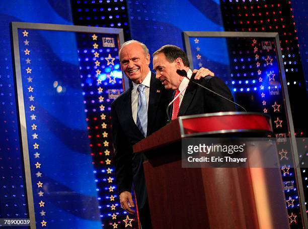 Republican presidential hopefuls former U.S. Sen. Fred Thompson and former Arkansas Gov. Mike Huckabee talk after a televised debate at the Myrtle...