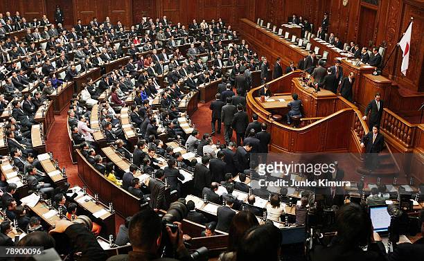 Upper house members vote during the full assembly where the House of Representatives pass the Anti Terrorism Special Measure bill at the Parliament...